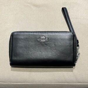 NEW Coach zip around wallet/clutch. Black leather w/silver hardware.